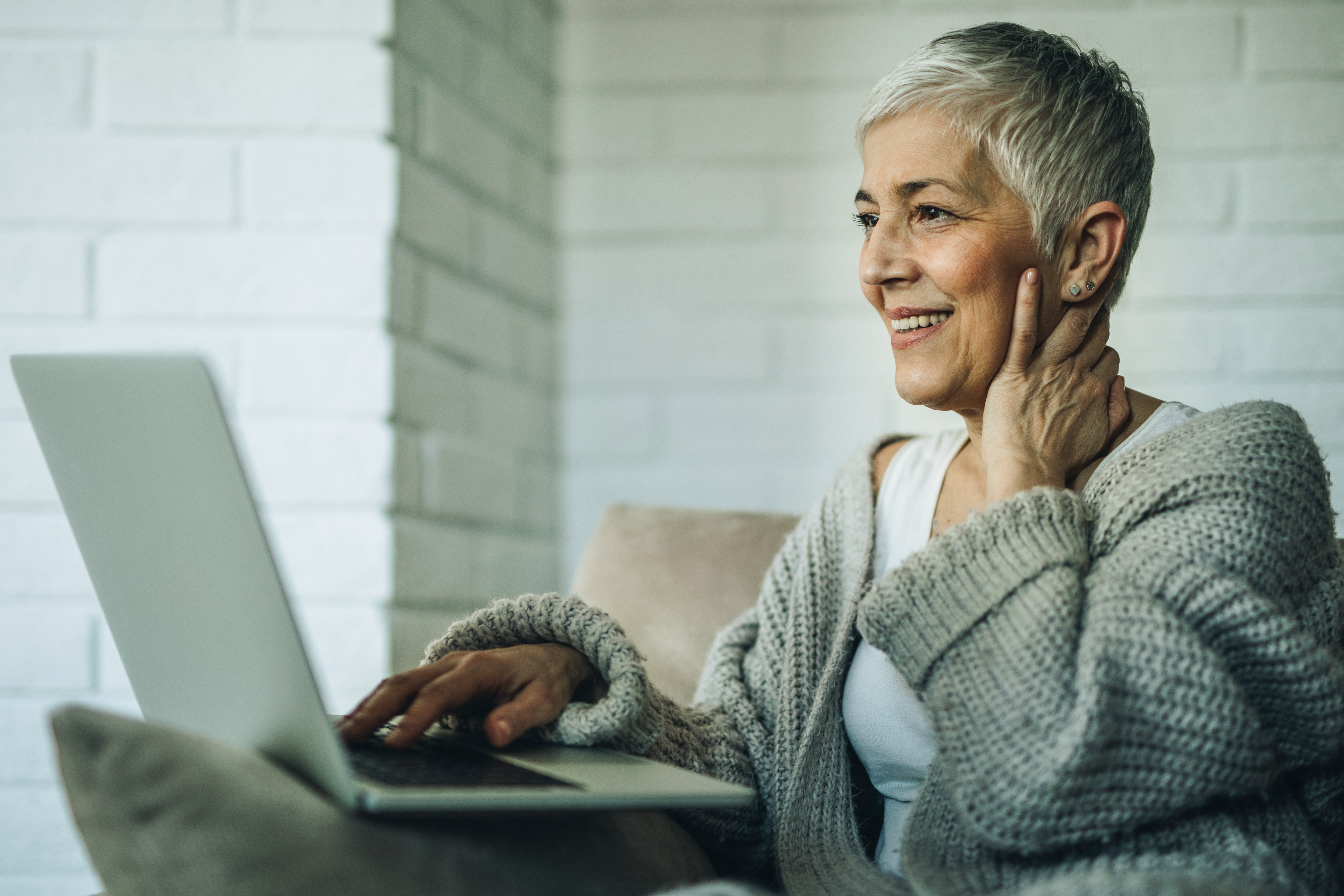 older woman looking at laptop